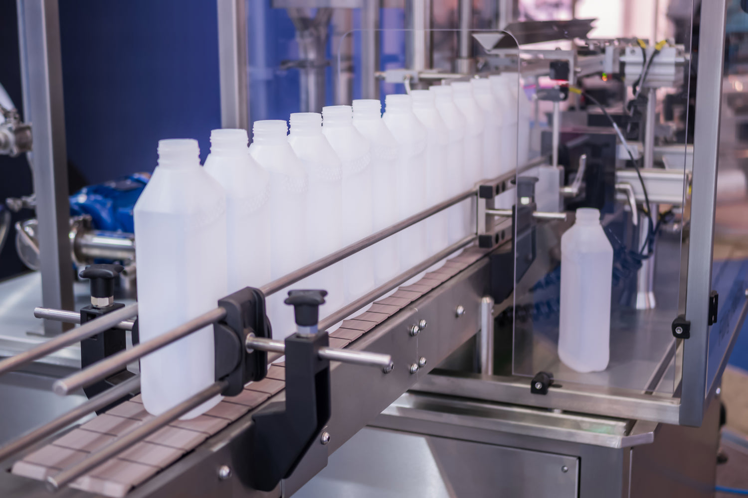 Row of bottles neatly arranged for packaging and display