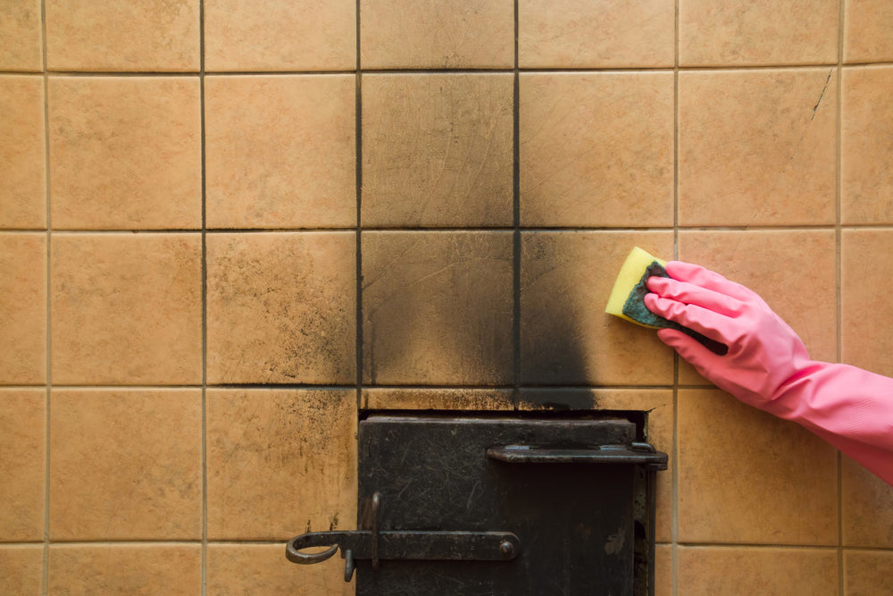 Cleaning soot from fire damage to restore surfaces and remove residue