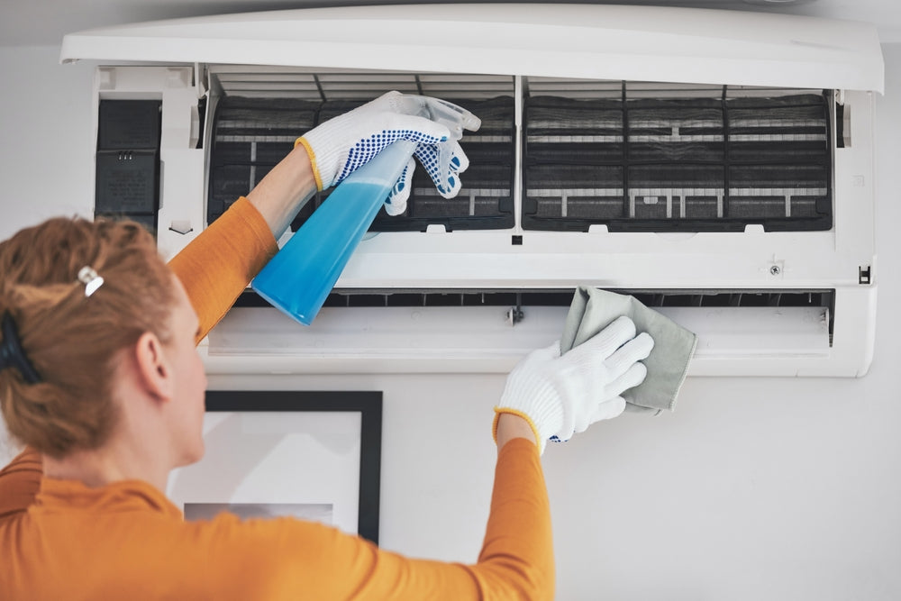 Air conditioner cleaning to enhance efficiency and improve indoor air quality